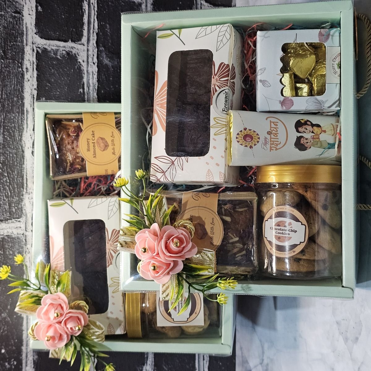 A curated festive hamper packed with brownies, cookies, tea cake and chocolates
